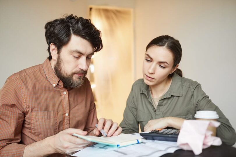 couple calculating moving costs