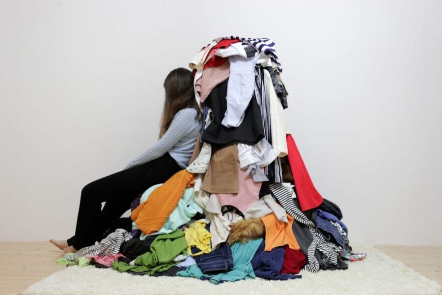 woman with a pile of clothes