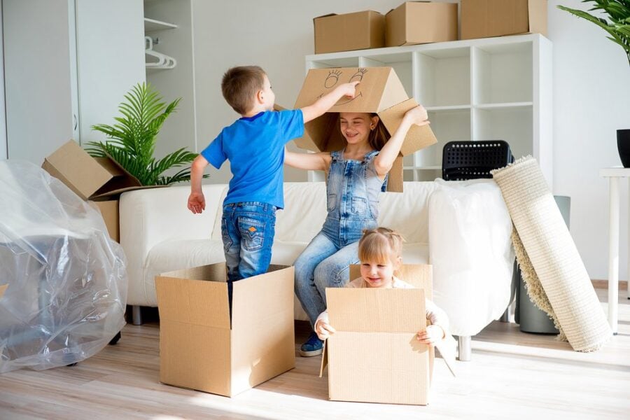 kids having fun with moving boxes