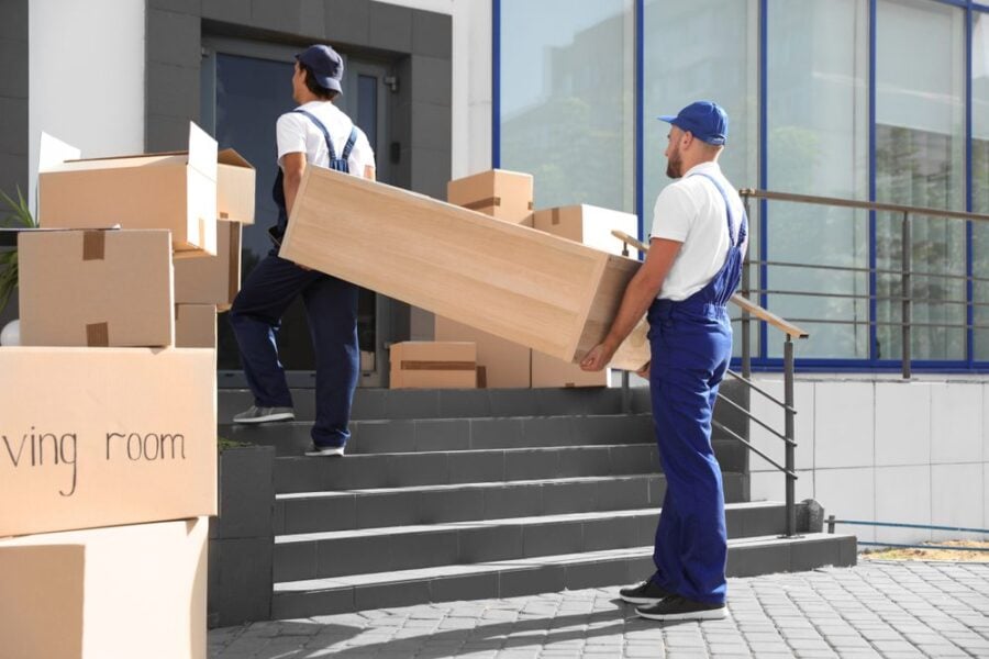 movers with furniture on stairs