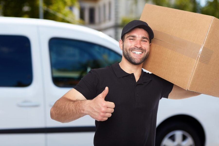 smiling mover with box thumbs up