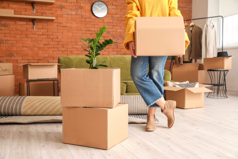 closeup of a woman with moving boxes