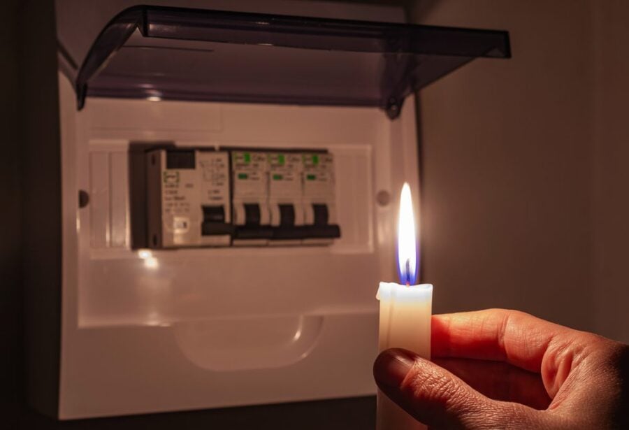 looking at a circuit breaker by candle light