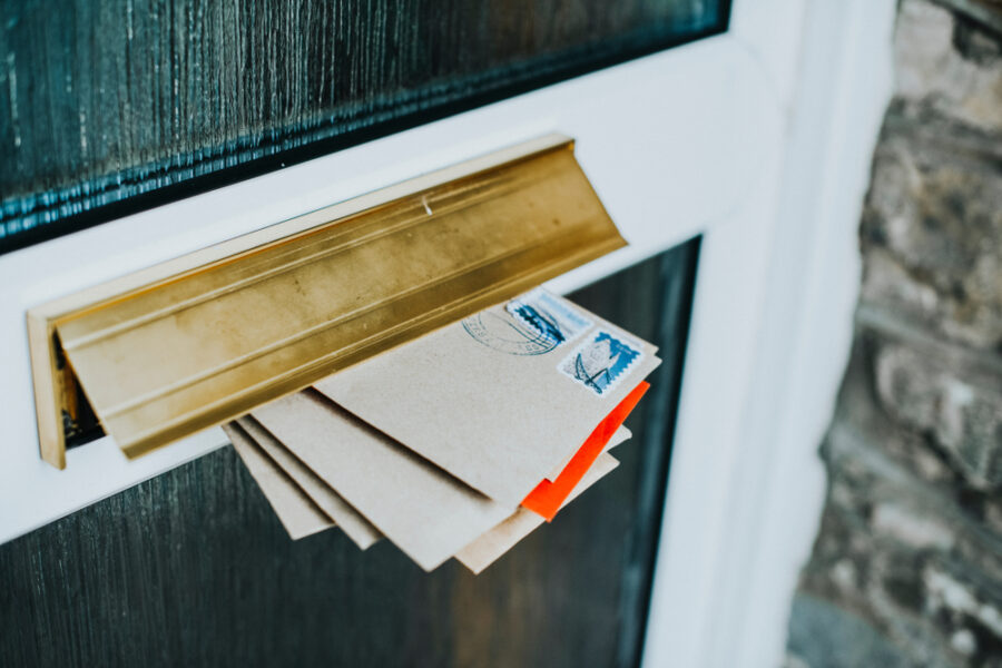 mail stuffed in residential mail slot