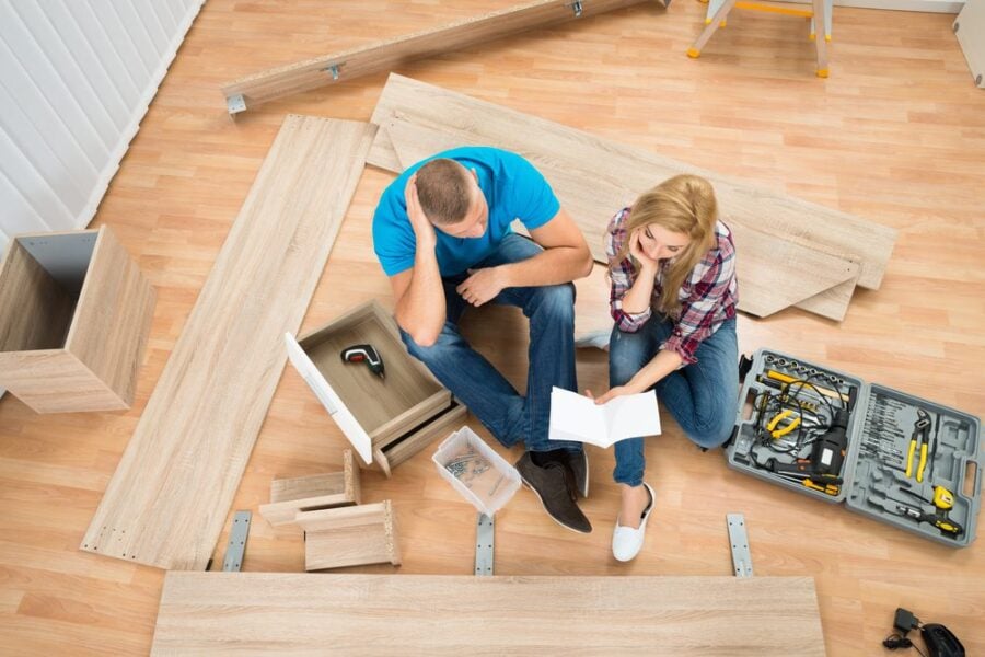 couple with disassembled furniture